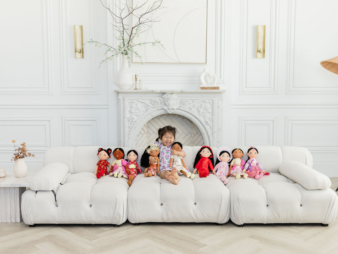 A row of Joeydolls on a sofa