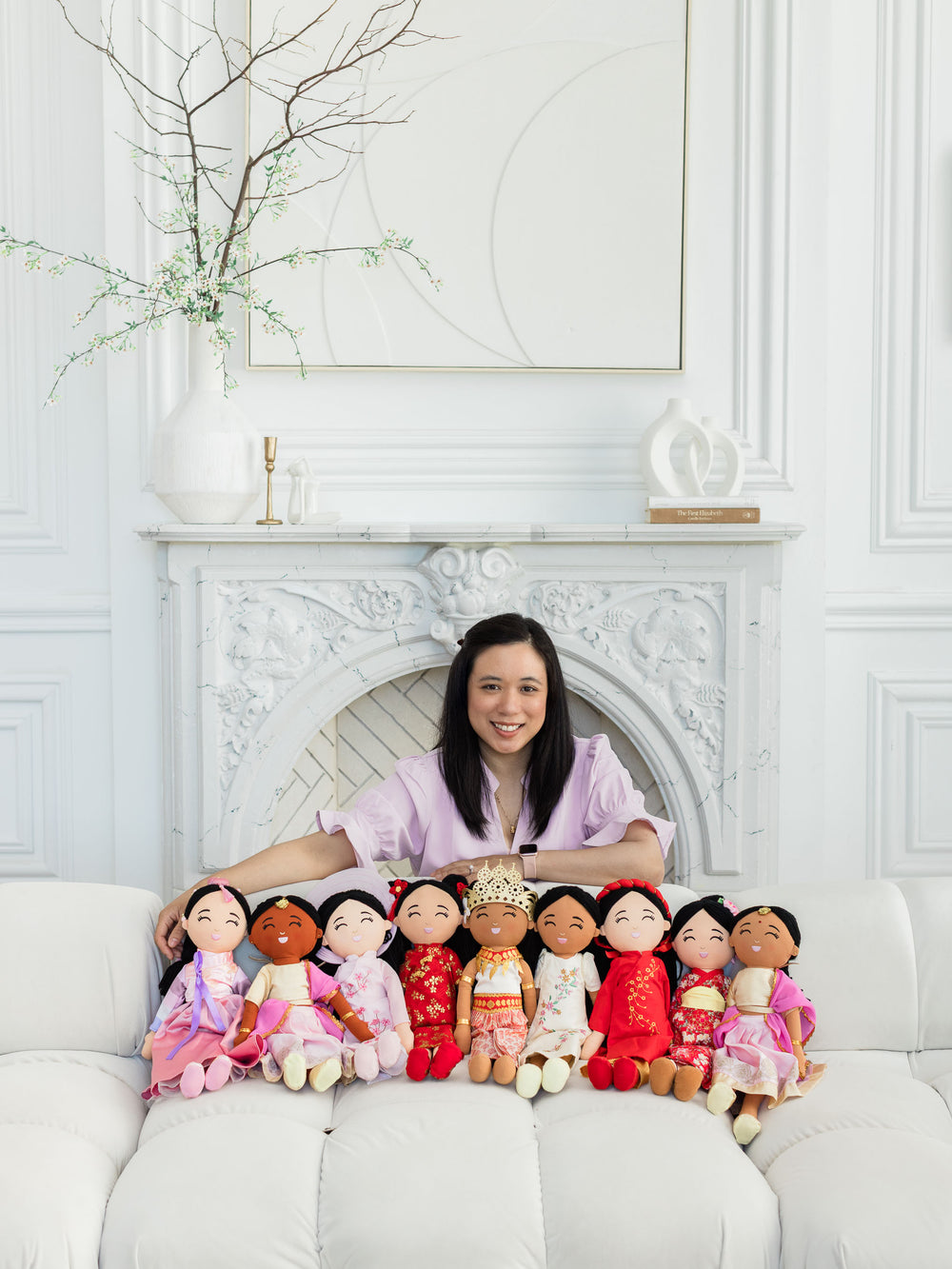 Joeydolls founder surrounded by the doll collection