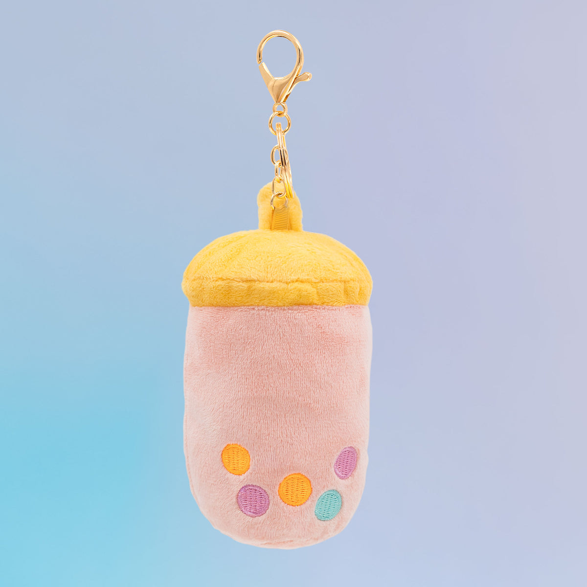 Back view of Taiwanese boba Food Pals bag charm showing a pink cup design with colorful tapioca pearls and a yellow lid