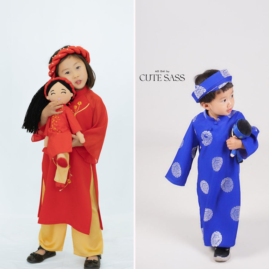 Two children in matching áo dài by Ao Dai by Cute Sass, a girl in red hugging Hoa and a boy in royal blue holding Minh