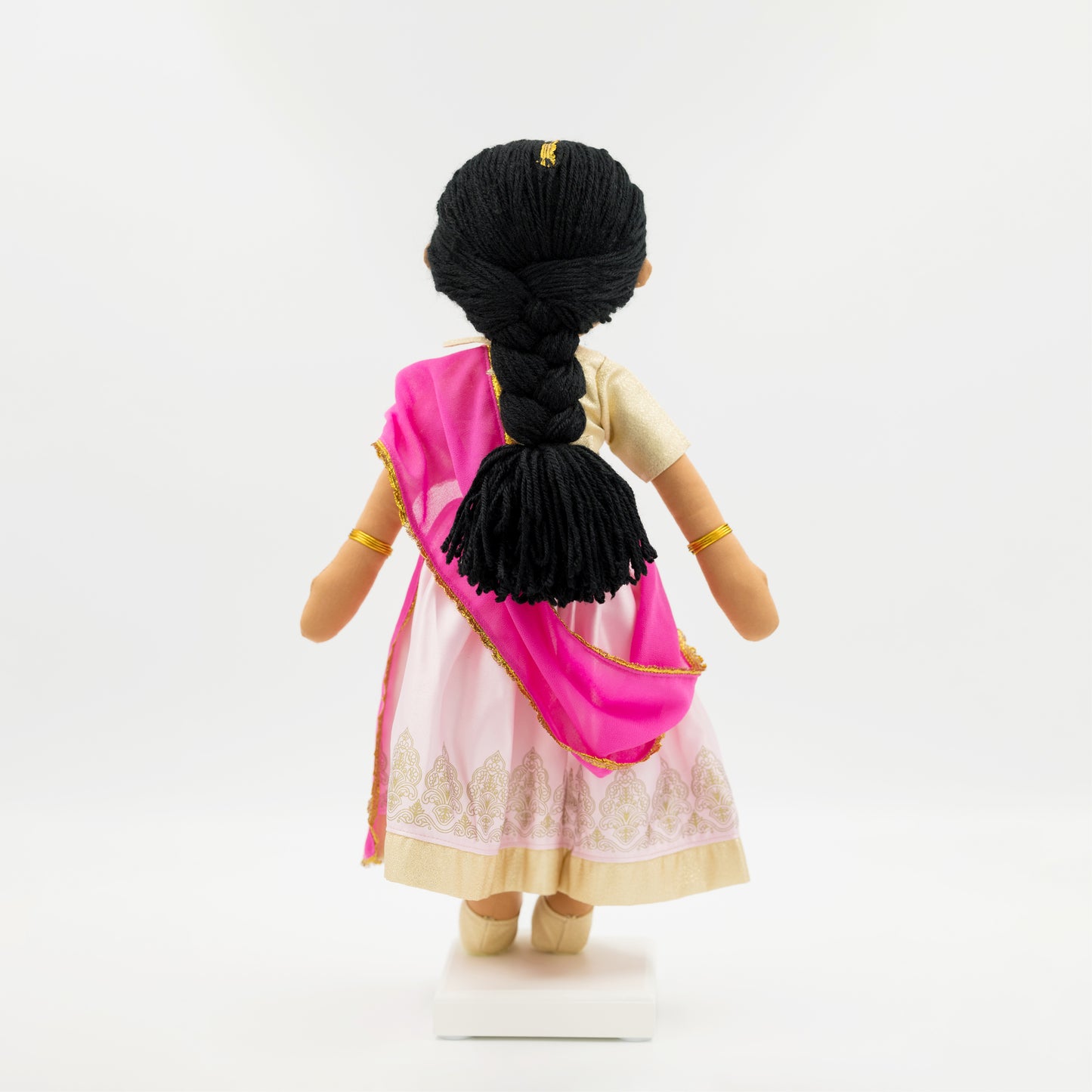 Back view of Priya Indian cultural doll showing braided hairstyle and traditional outfit
