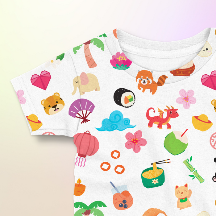 Asian Treasures baby and kids t-shirt close-up showing colorful printed icons including animals, food, and cultural elements.