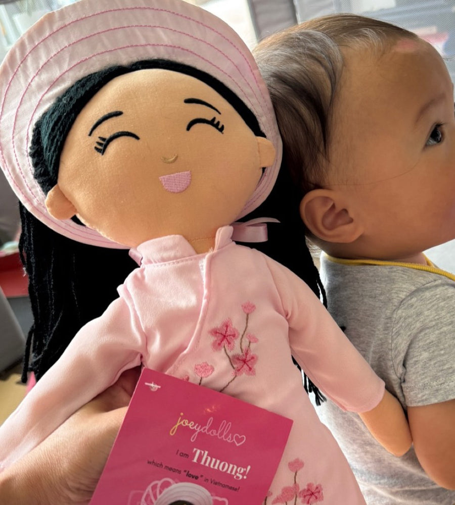 A little one with Thương, her very first doll