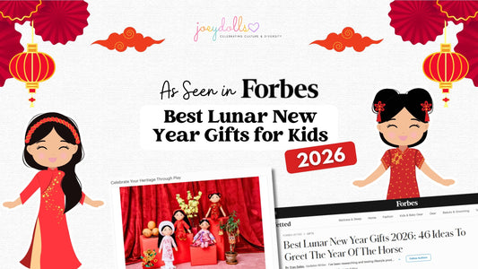 Joeydolls featured in Forbes Vetted as one of the Best Lunar New Year Gifts for Kids 2026, the Year of the Horse. The graphic features two diverse cultural dolls in traditional dress against a festive orange background with red lanterns.
