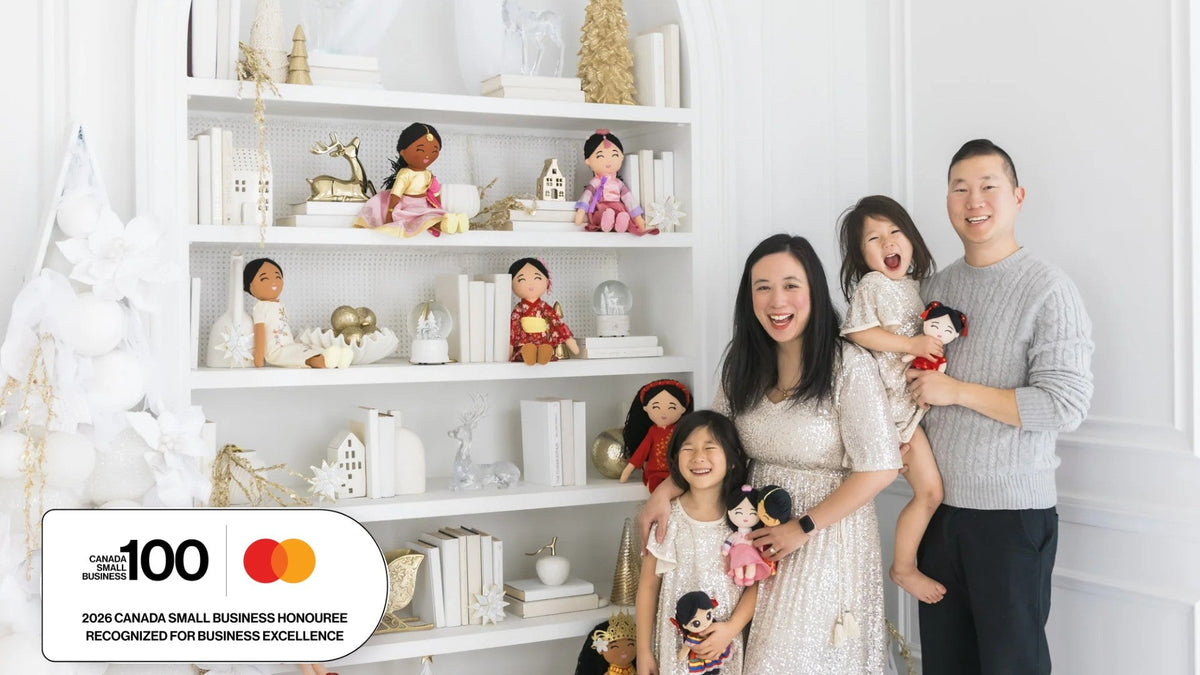 Joeydolls founder Samantha Ong with her family beside Joeydolls cultural dolls, with the 2026 Canada Small Business 100 Honouree badge