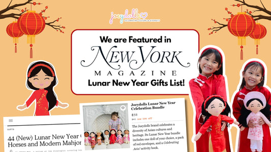 Joeydolls featured in New York Magazine's Lunar New Year Gifts List. The graphic shows two happy young girls in red Áo Dài holding Vietnamese dolls, framed by festive cherry blossoms and red lanterns.