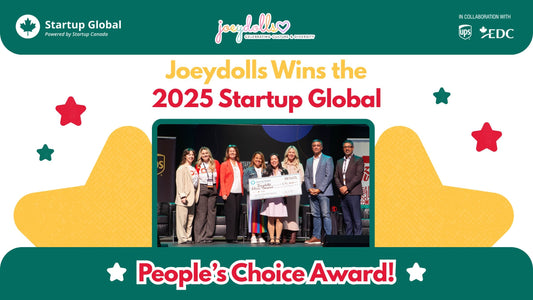 Joeydolls founder holding a large $15,000 check at the Startup Canada event backdrop, celebrating the People’s Choice Award win.