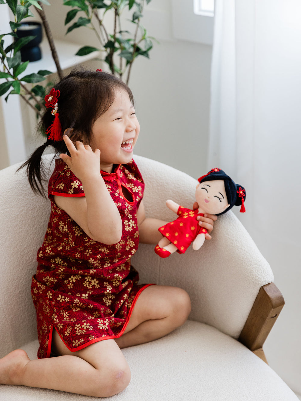 A child playing with her Joeydoll