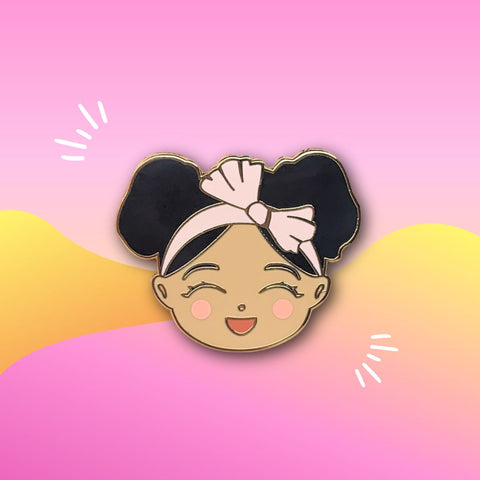 Joeydolls Cheerful Jasmine gold enamel pin featuring a smiling girl character with double buns and a pink headband on a colorful background.