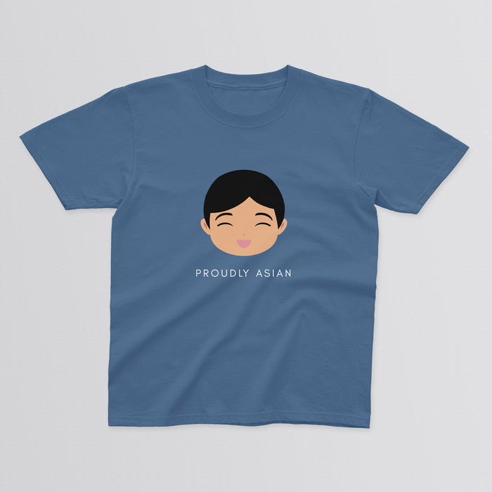 Proudly Asian Boy baby and kids t-shirt in blue with a graphic of a smiling boy’s face with short black hair, with “Proudly Asian” text below.