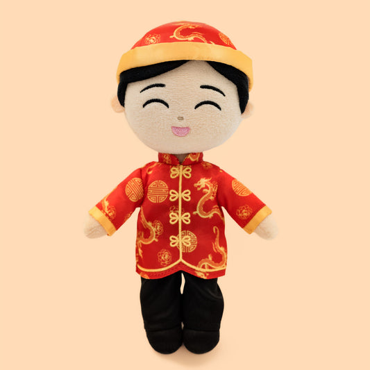 Chinese Boy Cultural Mini Doll wearing a traditional red tang jacket with gold dragon patterns, black pants, and a matching festive hat, smiling with embroidered eyes and soft plush features.
