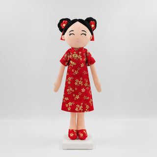 Mei Chinese cultural doll in a traditional qi pao dress with gold pattern