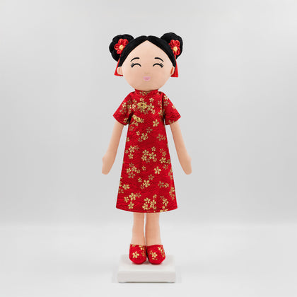 Mei Chinese cultural doll in a traditional qi pao dress with gold pattern