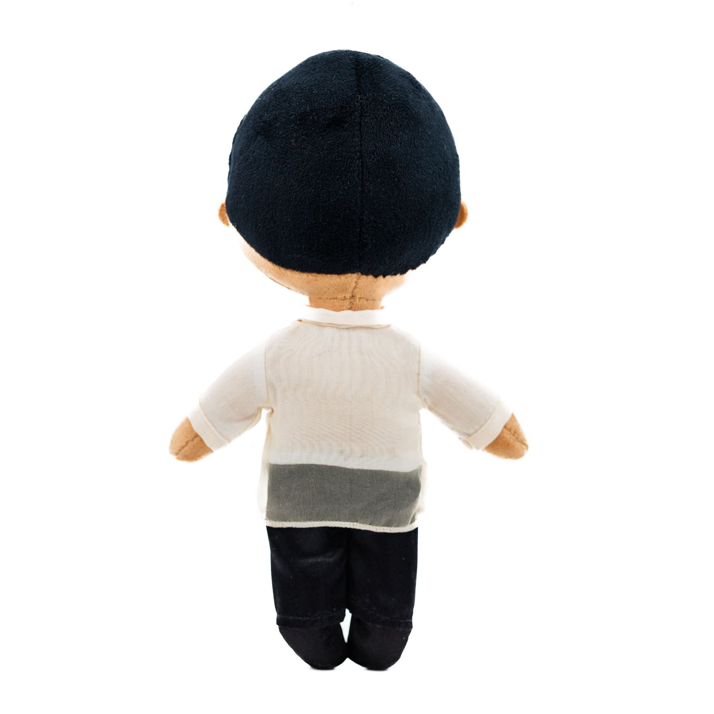 Back view of a Filipino boy plush doll wearing a traditional cream Barong Tagalog-inspired shirt with black pants and short black hair against a white background.