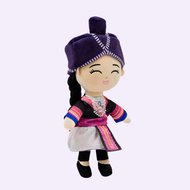 Angled view of Joeydolls Maiv Hmong doll with the white side of her reversible skirt