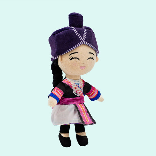 Angled front view of Maiv, a soft plush Hmong Cultural Mini Doll with a smiling face, silver necklace (xauv), colorful traditional outfit, braided hair, and soft plush details perfect for cuddles and imaginative play.