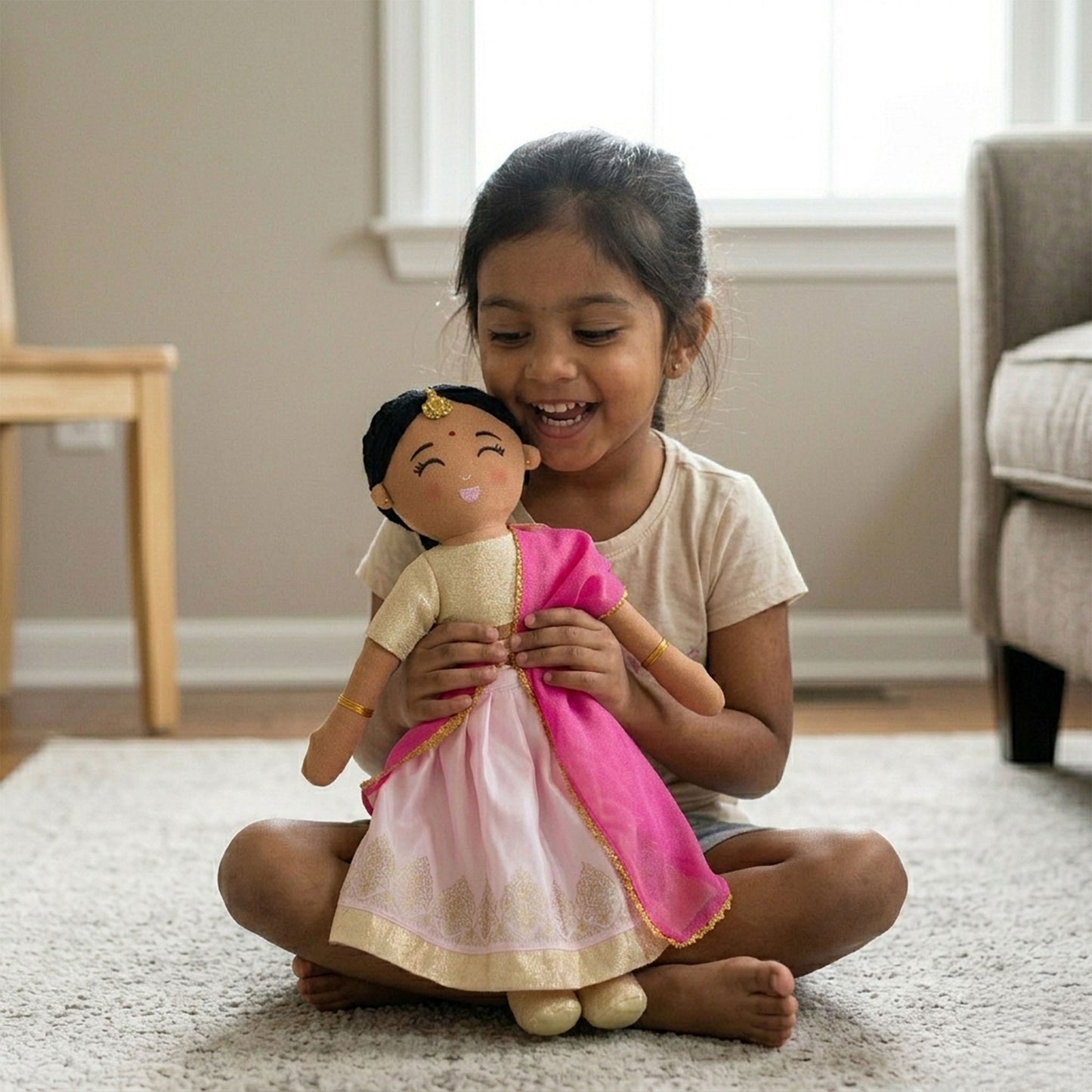Child sitting and playing with Priya Indian cultural doll, encouraging joyful and imaginative play