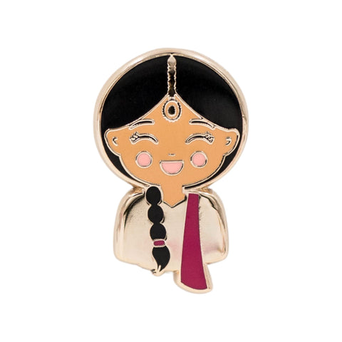 Joeydolls Indian Priya enamel pin featuring a smiling girl character wearing a pink lehenga with a bright pink dupatta, a maang tikka, and a braid over the shoulder.