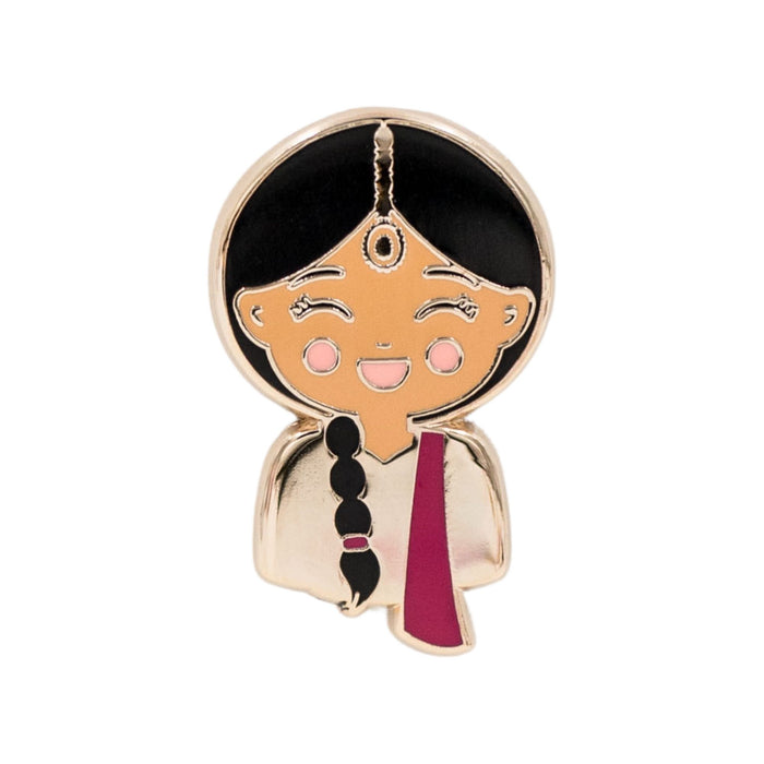 Joeydolls Indian Priya enamel pin featuring a smiling girl character wearing a pink lehenga with a bright pink dupatta, a maang tikka, and a braid over the shoulder.