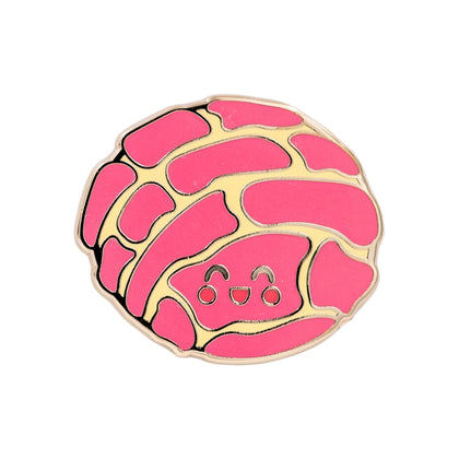 Concha Mexican sweet bread enamel pin featuring a smiling pink concha with a signature shell-like pattern.