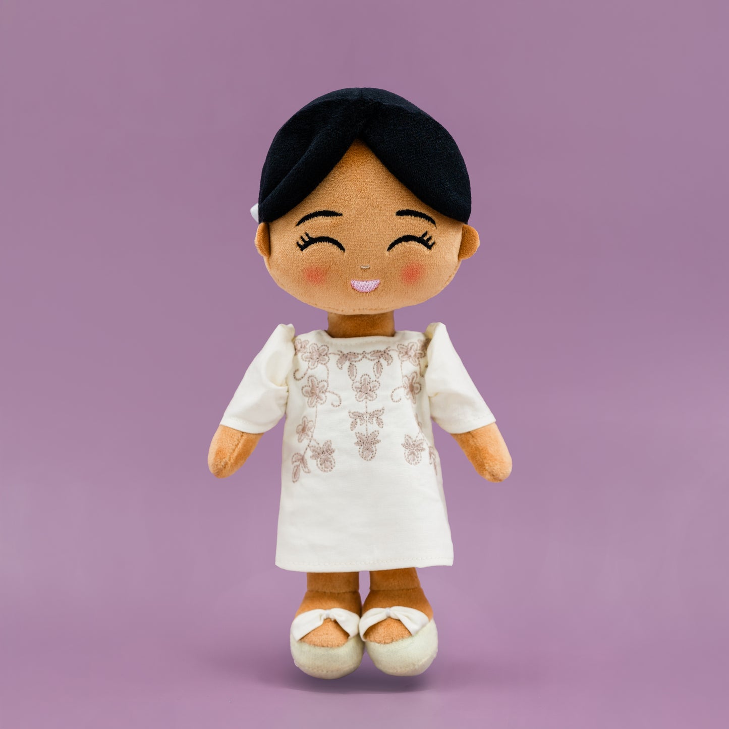 Malaya Filipina cultural mini doll wearing a Filipiniana dress with butterfly sleeves.