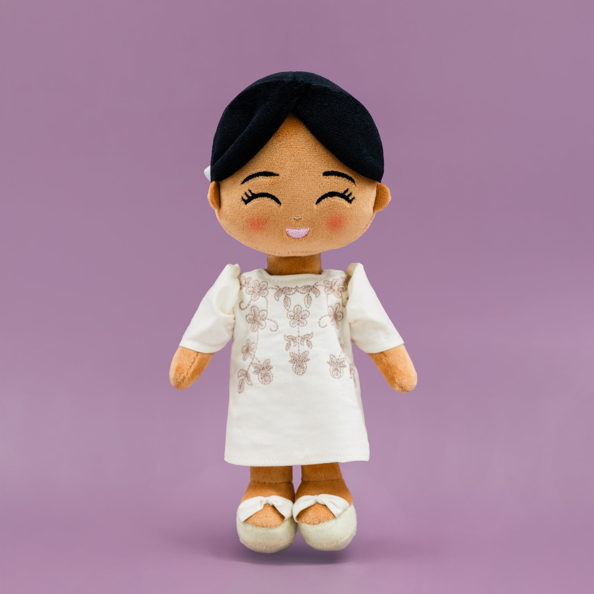 Malaya Filipina cultural mini doll wearing a Filipiniana dress with butterfly sleeves.