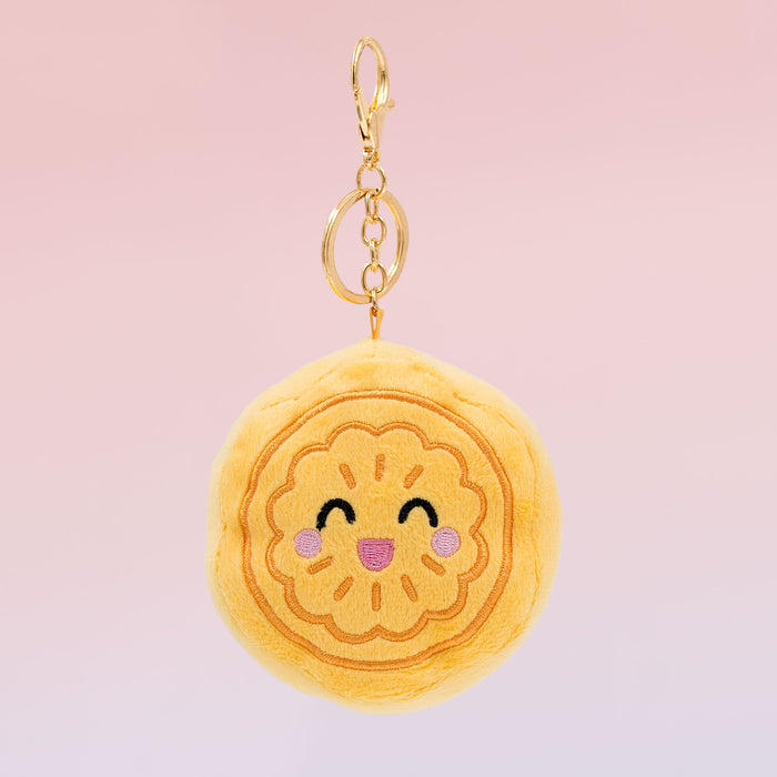 Chinese mooncake Food Pals keychain featuring a smiling yellow mooncake design with a gold clasp