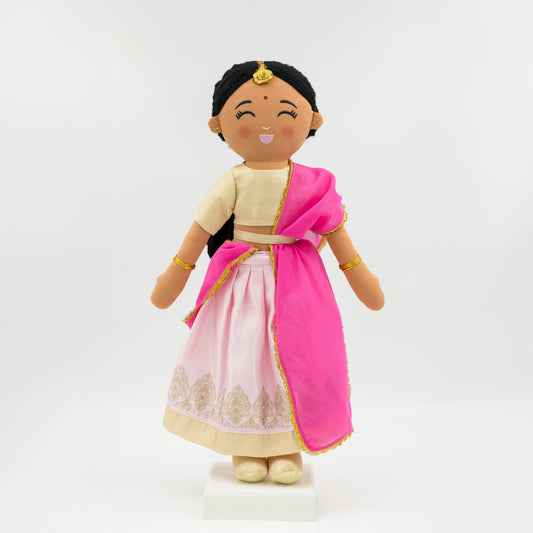 Priya Indian cultural doll wearing a gold choli top and pink lehenga with gold embroidery, a flowing pink dupatta, and traditional bindi and tikka
