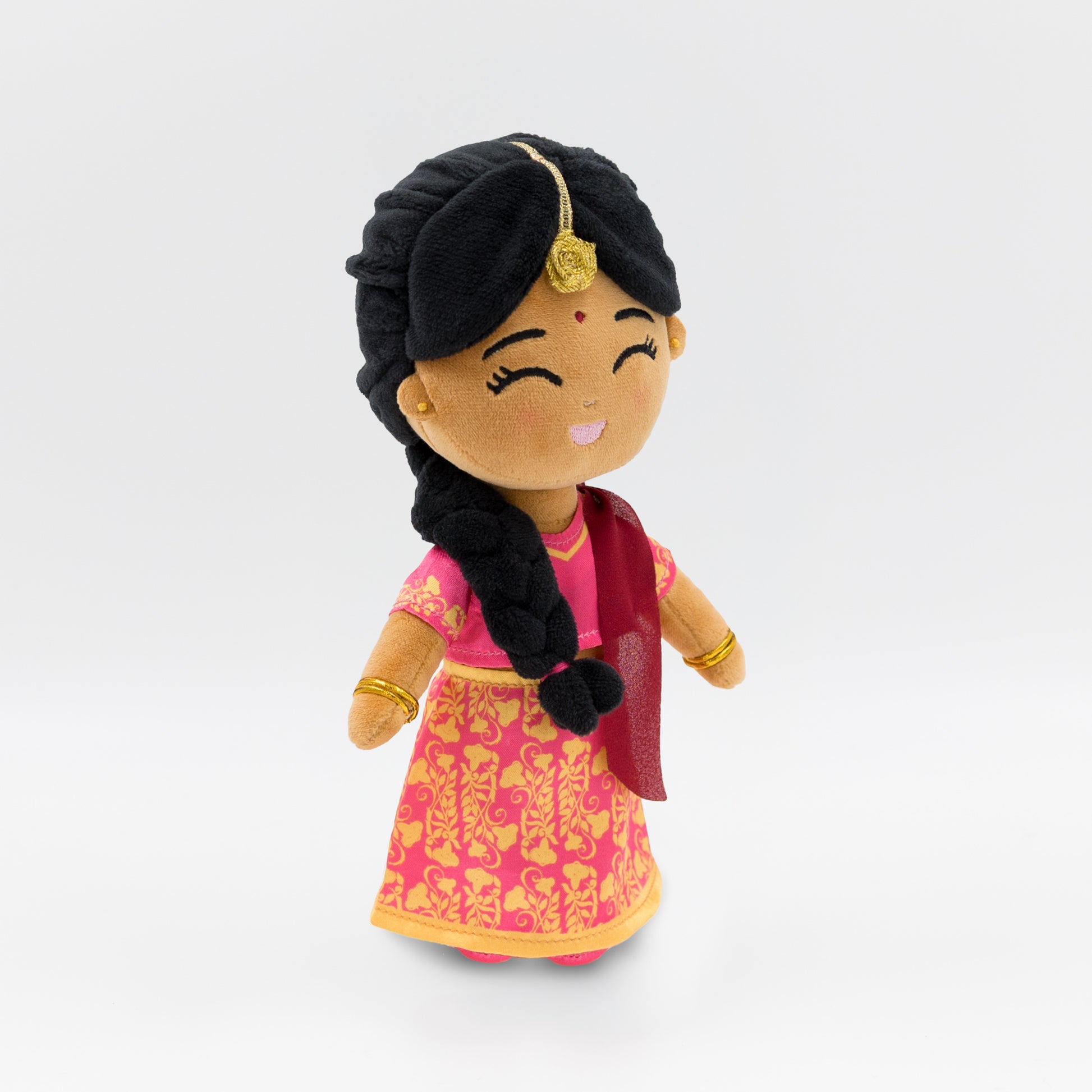 Side view of Indian cultural plush doll Priya, showing her pink blouse, red dupatta, and traditional gold jewelry — a soft toy celebrating Indian heritage for toddlers and preschoolers.