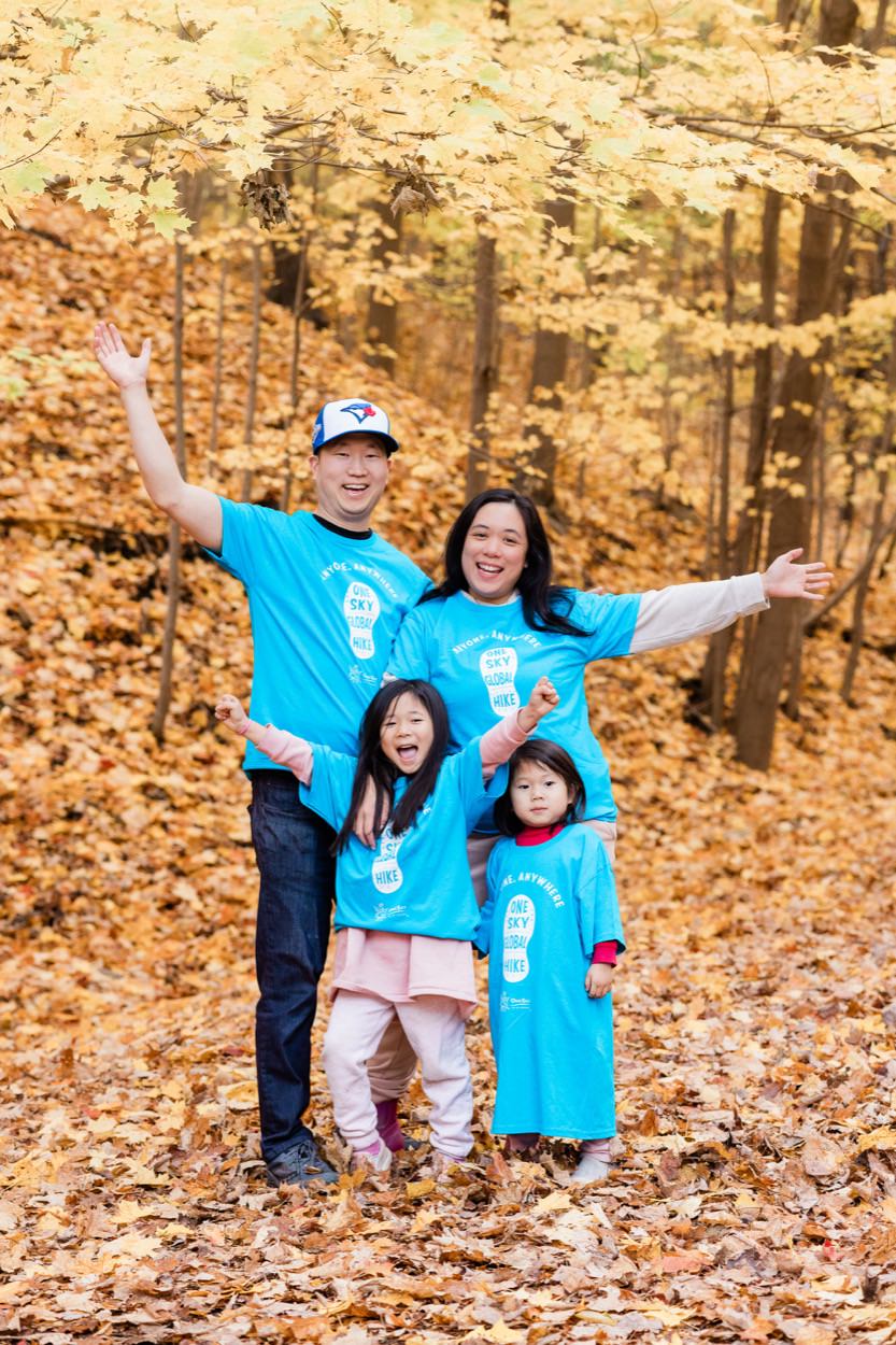 Samantha and her family outdoors in autumn, supporting OneSky