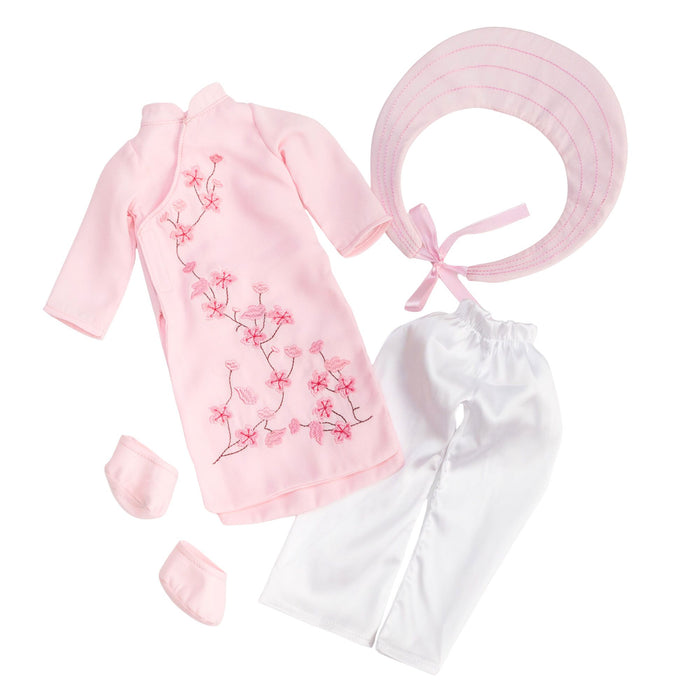 Pink Áo Dài (Thuong) outfit for 18” Hoa Signature Doll displayed in a flat lay view, showing a pink áo dài with floral embroidery, white pants, a pink khăn đóng headpiece, and matching pink shoes.