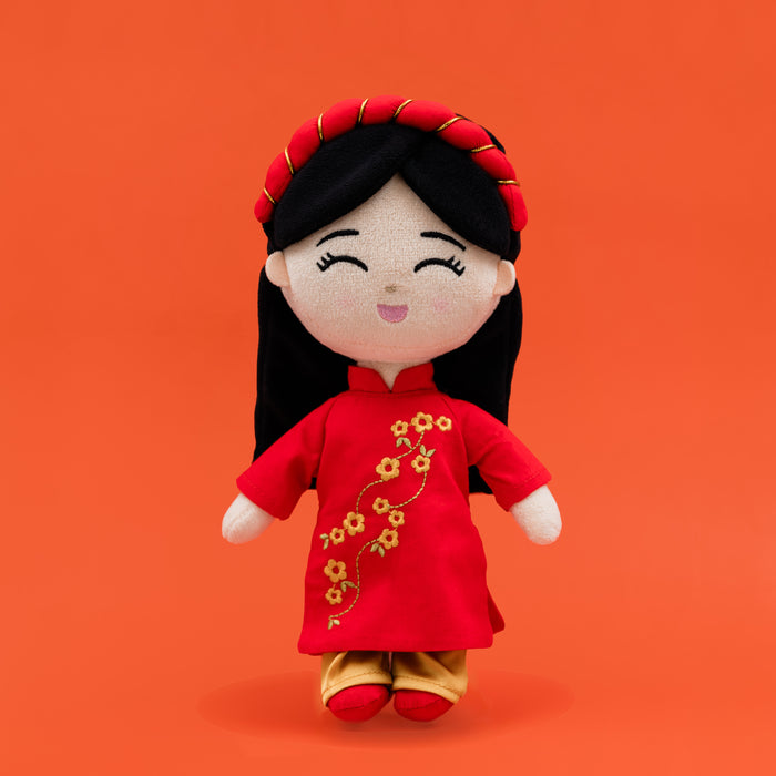 Hoa Vietnamese cultural mini doll wearing a red áo dài, matching shoes, and a khăn đóng.