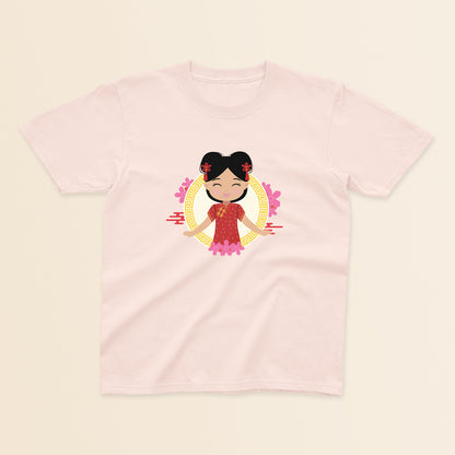 Chinese Cultural Celebration baby and kids tee in light pink featuring a smiling girl with black hair styled in double buns and red accessories, wearing a red and gold qipao, set against a circular gold pattern with pink floral details.