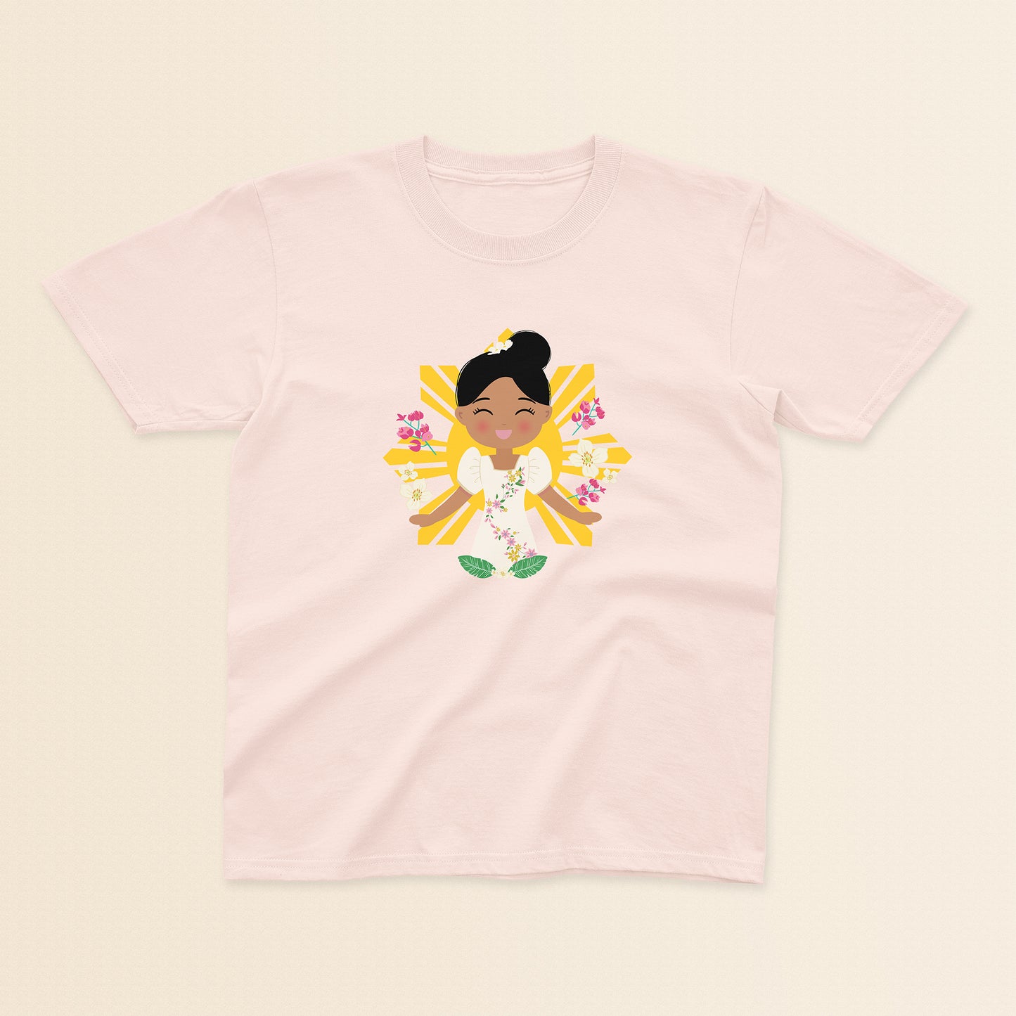 Filipina Cultural Celebration baby and kids t-shirt in light pink with a graphic of a smiling girl wearing a floral Filipiniana dress, hair in a bun, set against a Filipino sun and surrounded by floral elements.