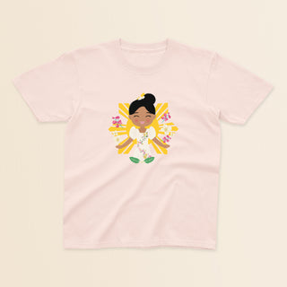 Filipina Cultural Celebration baby and kids t-shirt in light pink with a graphic of a smiling girl wearing a floral Filipiniana dress, hair in a bun, set against a Filipino sun and surrounded by floral elements.