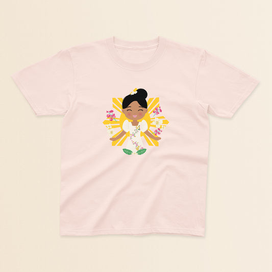 Filipina Cultural Celebration baby and kids t-shirt in light pink with a graphic of a smiling girl wearing a floral Filipiniana dress, hair in a bun, set against a Filipino sun and surrounded by floral elements.