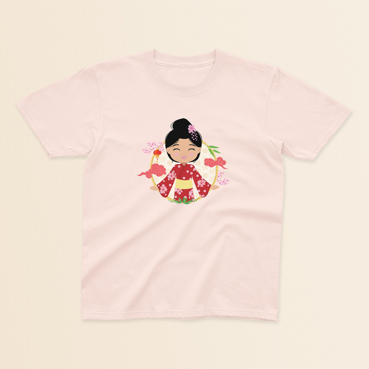 Japanese Cultural Celebration baby and kids t-shirt in light pink with a graphic of a smiling girl with her hair in a high bun with a pink flower, wearing a red sakura-patterned kimono with a yellow obi sash, set against a circular background with cherry blossoms and traditional elements.