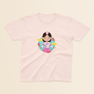 Korean Cultural Celebration baby and kids t-shirt in light pink with a graphic of a smiling girl with long hair adorned with a daenggi ribbon and a jokduri headpiece, wearing a pink hanbok with a norigae ornament, set against a circular background with floral elements and traditional patterns.