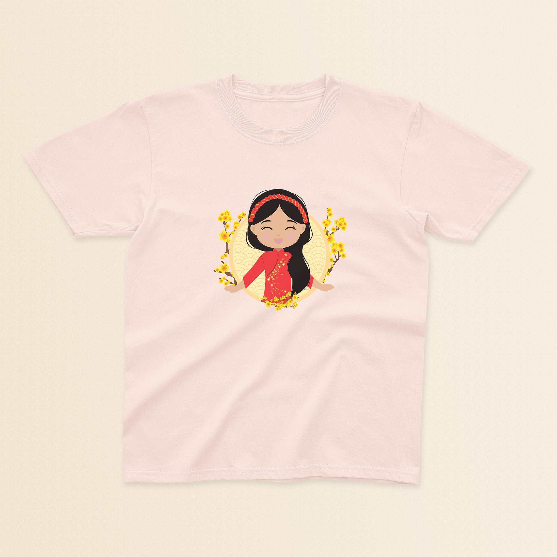 Vietnamese Cultural Celebration baby and kids tee in light pink featuring a printed illustration of a smiling girl with long black hair, wearing a red áo dài featuring delicate mai flower details and a traditional khăn đóng headpiece, set against a circular yellow background with floral elements.