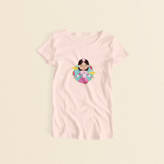 Korean Cultural Celebration women’s t-shirt in light pink with a graphic of a smiling girl with long hair adorned with a daenggi ribbon and a jokduri headpiece, wearing a pink hanbok with a norigae ornament, set against a circular background with floral elements and traditional patterns.