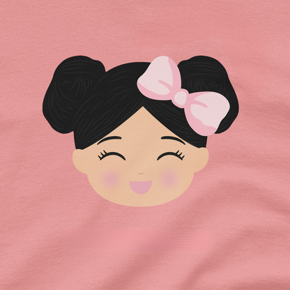 A close-up of a pink fabric surface featuring a Joeydolls Icon graphic of a girl's face with black hair in two buns and a pink bow.