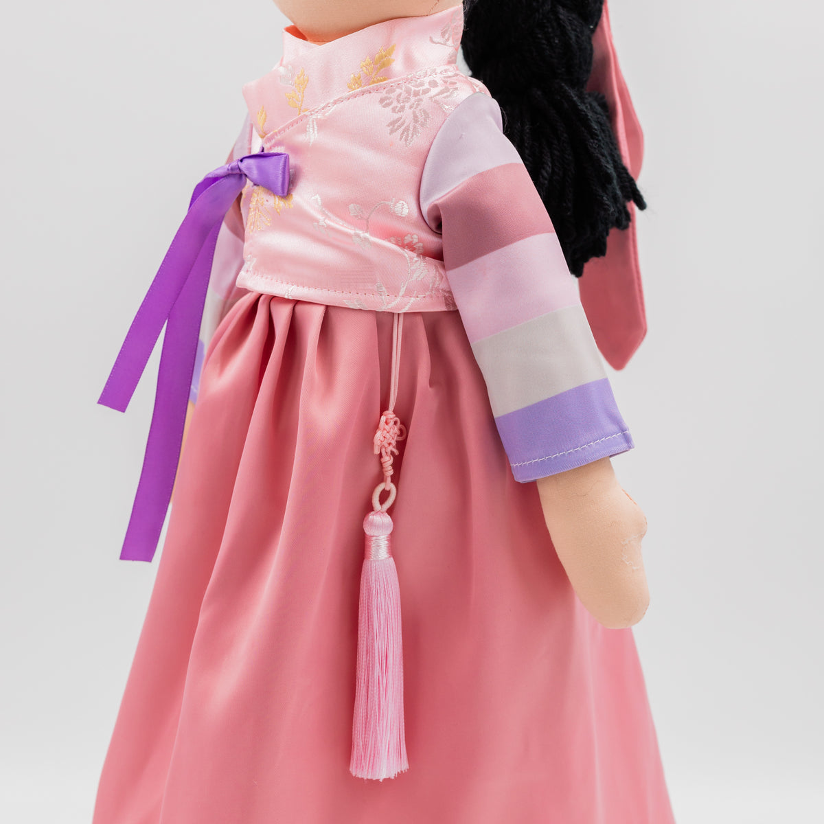 Side view of Joeydolls Danbi Korean doll with striped sleeves and a norigae tassel