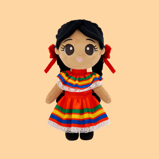 Meet Xochitl 🌸 (pronounced so-cheel), named after the Nahuatl word for “flower.” Dressed in her colorful Jalisco folklórico ribbon dress, inspired by Mexico’s traditional folk dancers, she celebrates the beauty, rhythm, and pride of her heritage. Soft plush Mexican girl doll with braided black hair, red ribbons, white lace details.
