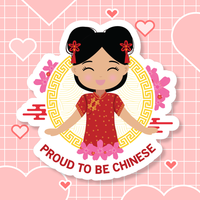 Proud to Be Chinese die-cut sticker featuring a smiling girl with her hair in two buns adorned with red accessories, wearing a vibrant red and gold qipao, set against a circular gold pattern with pink floral elements, with “Proud to Be Chinese” text below.