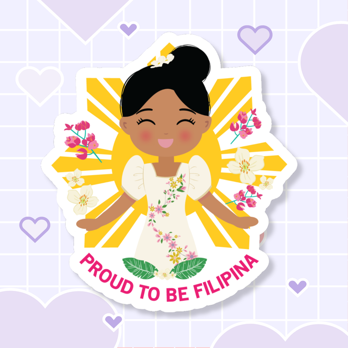 Proud to Be Filipina die-cut sticker featuring a smiling girl with her hair in a high bun adorned with sampaguita flowers, wearing a Filipiniana dress, set against a Filipino sun background with floral elements, with “Proud to Be Filipina” text below.