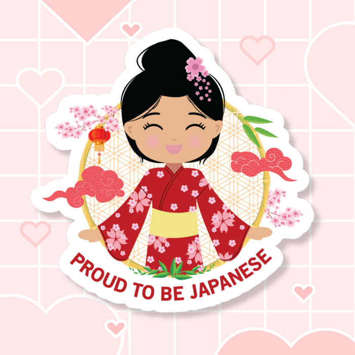 Proud to Be Japanese die-cut sticker featuring a smiling girl with her hair in a high bun adorned with a pink flower, wearing a red sakura-patterned yukata paired with a bold yellow obi sash, set against a circular background with cherry blossoms and traditional elements, with “Proud to Be Japanese” text below.