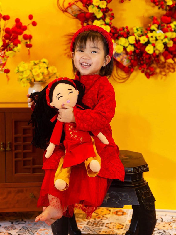 Kids with a Vietnamese cultural doll