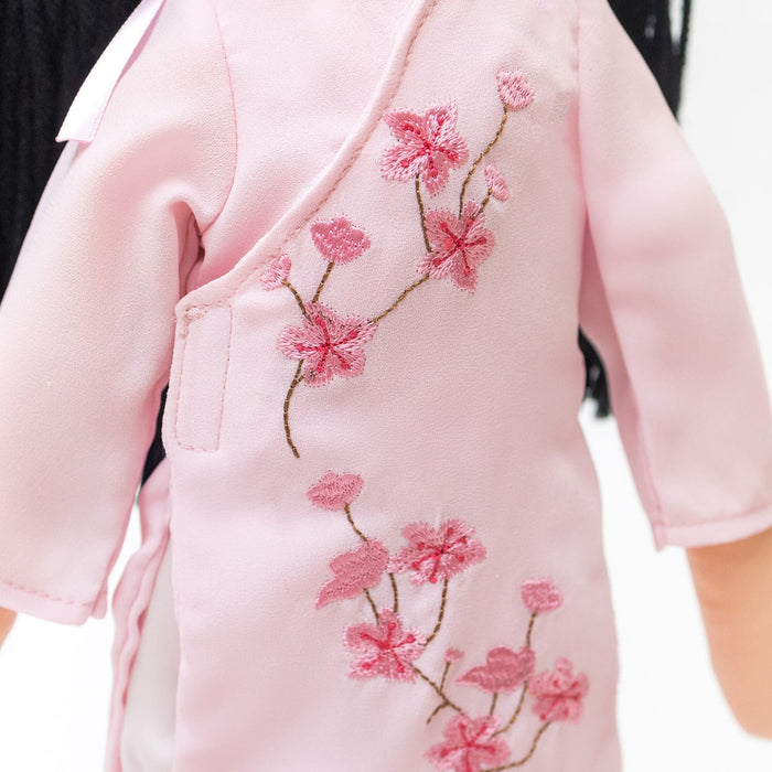 Peach blossom embroidery on Thương's pink áo dài