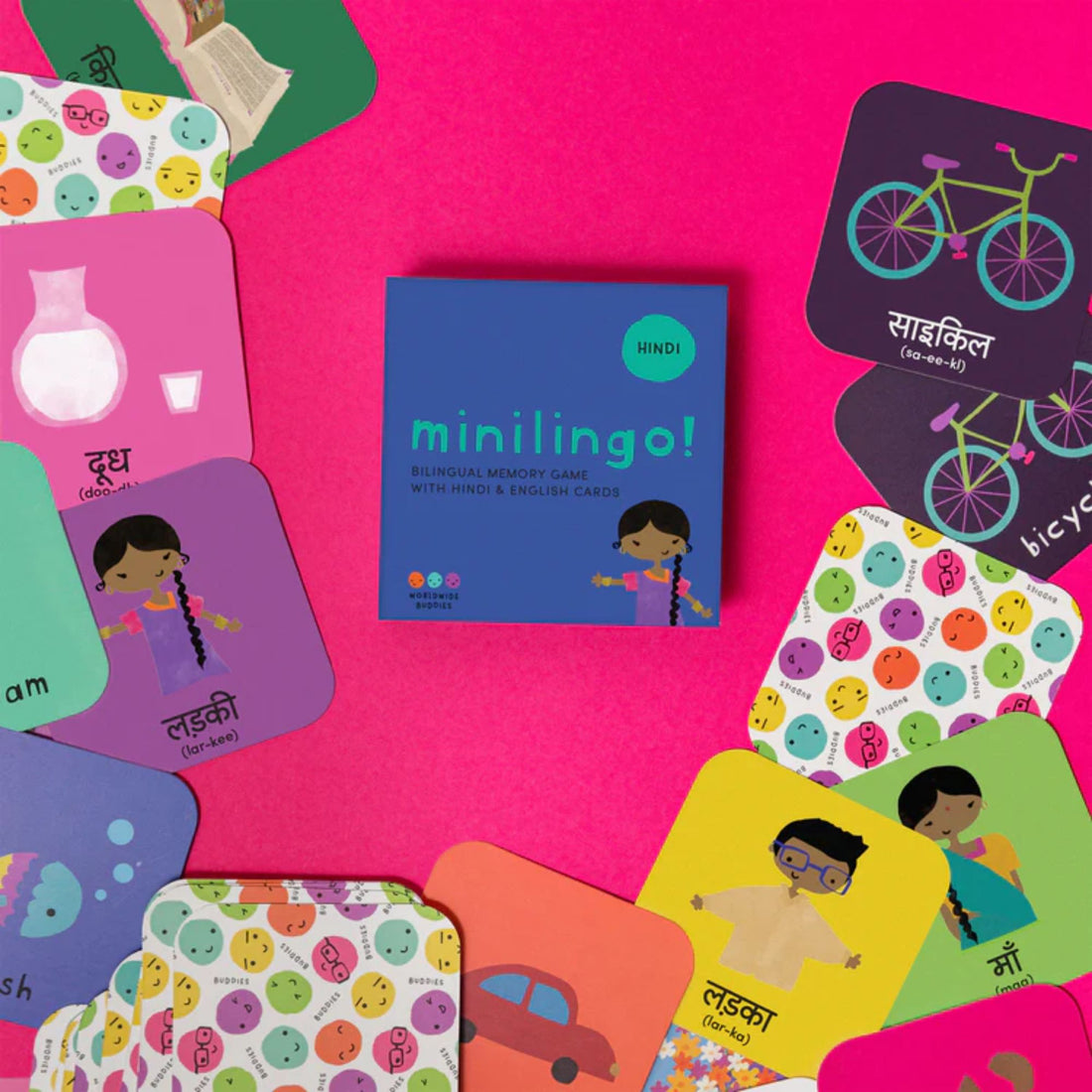 Colorful bilingual flashcards spread out with Hindi and English words and playful illustrations