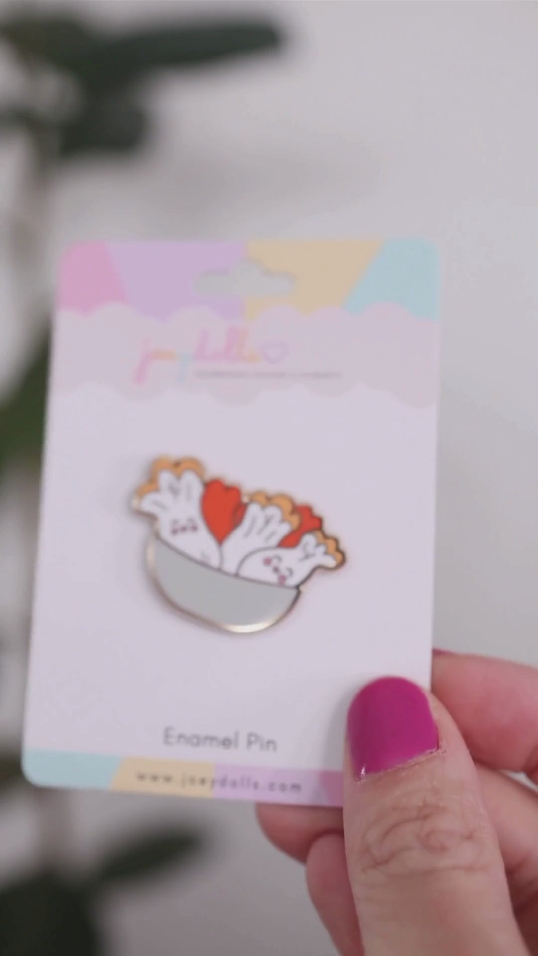 Kimchi Korean fermented cabbage enamel pin on a Joeydolls display card, gently moving to highlight its cabbage details, kimchi seasoning, and glossy finish.